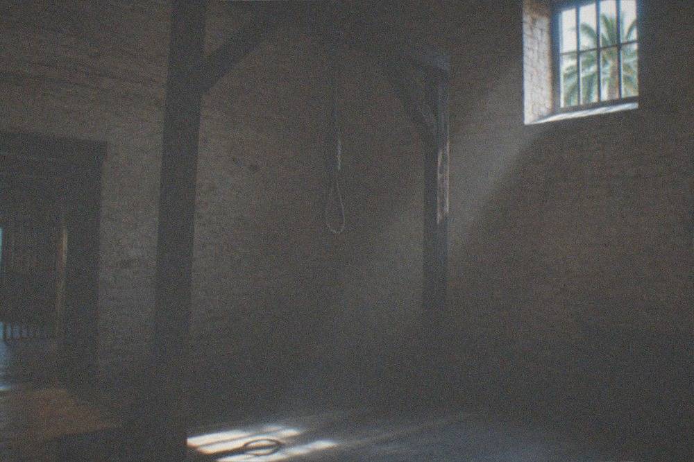 The gallows area inside the Old Jail shown in low light