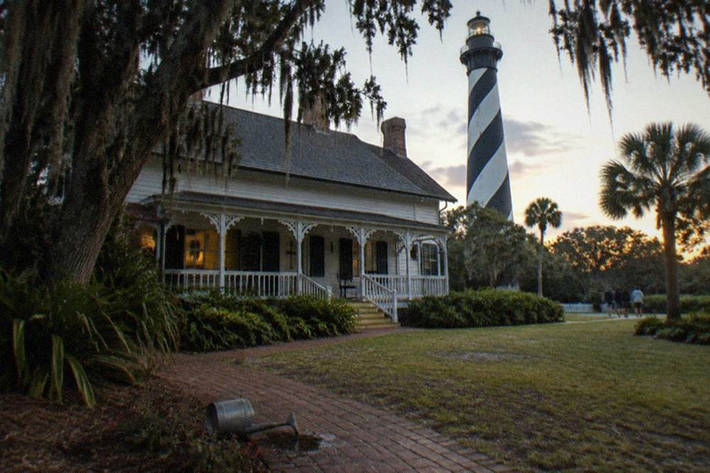 The lighthouse keeper's house and grounds at dusk