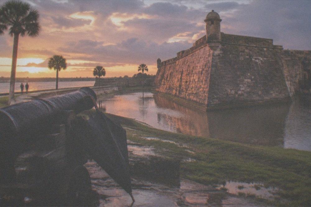 The Castillo de San Marcos fort walls glowing under evening light